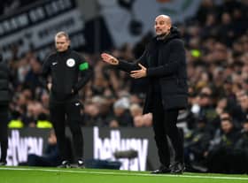 Pep Guardiola, Manager of Manchester City, gives the team instructions during the Premier League match between Tottenham Hotspur and Manchester City 