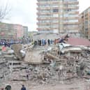 Rescue workers and volunteers conduct search and rescue operations in the rubble of a collasped building, in Diyarbakir on February 6, 2023, after a 7.8-magnitude earthquake.