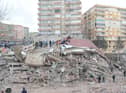 <p>Rescue workers and volunteers conduct search and rescue operations in the rubble of a collasped building, in Diyarbakir on February 6, 2023, after a 7.8-magnitude earthquake.</p>