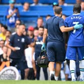 Chelsea's French midfielder N'Golo Kante (R) leaves the game injured during the English Premier League football match between Chelsea and Tottenham Hotspur