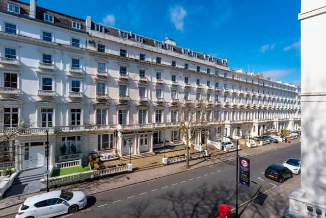 An exterior picture of the hotel that’s made up of five combined residences 