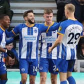 Brighton's English midfielder Adam Lallana (C) celebrates with teammates after scoring their second goal during the English FA cup third round football match