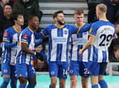 Brighton's English midfielder Adam Lallana (C) celebrates with teammates after scoring their second goal during the English FA cup third round football match