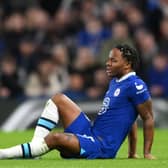 Raheem Sterling of Chelsea looks on as they lie on the floor, shortly before receiving medical treatment (Photo by Shaun Botterill/Getty Images)