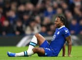 Raheem Sterling of Chelsea looks on as they lie on the floor, shortly before receiving medical treatment (Photo by Shaun Botterill/Getty Images)