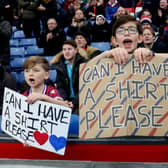 : Crystal Palace fans hold banners which read 'Can I Have A Shirt Please' prior to the Premier League match between Crystal Palace and Brighton