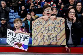 : Crystal Palace fans hold banners which read 'Can I Have A Shirt Please' prior to the Premier League match between Crystal Palace and Brighton