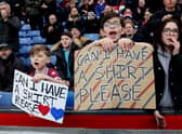 : Crystal Palace fans hold banners which read 'Can I Have A Shirt Please' prior to the Premier League match between Crystal Palace and Brighton