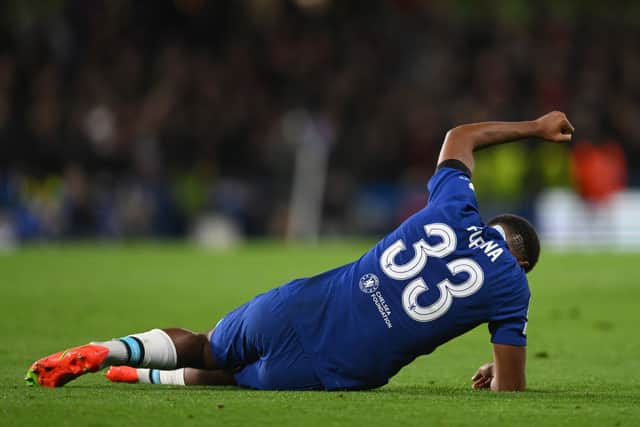Wesley Fofana of Chelsea is injured during the UEFA Champions League group E match between Chelsea FC and AC Milan  (Photo by Mike Hewitt/Getty Images)