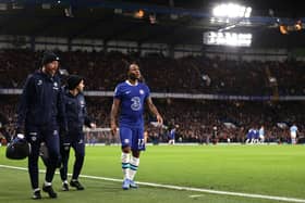 Raheem Sterling of Chelsea looks on after leaving the field following medical treatment and being replaced by Pierre-Emerick Aubameyang 