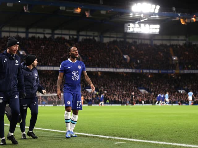 Raheem Sterling of Chelsea looks on after leaving the field following medical treatment and being replaced by Pierre-Emerick Aubameyang 