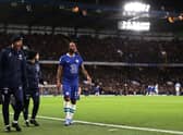 Raheem Sterling of Chelsea looks on after leaving the field following medical treatment and being replaced by Pierre-Emerick Aubameyang 