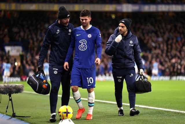 Christian Pulisic of Chelsea looks on after leaving the field following medical treatment, shortly before being replaced (Photo by Ryan Pierse/Getty Images)