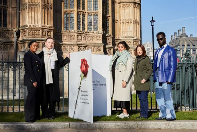 Campaigners from Make it Mandatory pose with a giant Valentine’s Day card outside the Houses of Parliament. Credit: Stacey Osborne