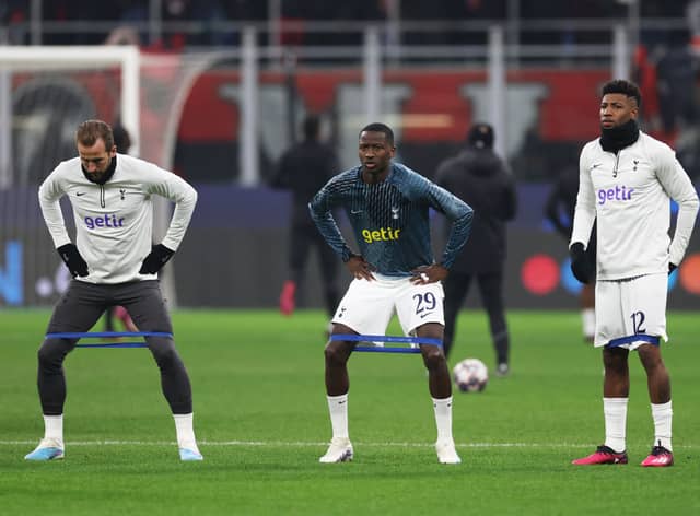 Harry Kane, Pape Matar Sarr and Emerson of Tottenham Hotspur warm up prior to the UEFA Champions League round  (Photo by Catherine Ivill/Getty Images)