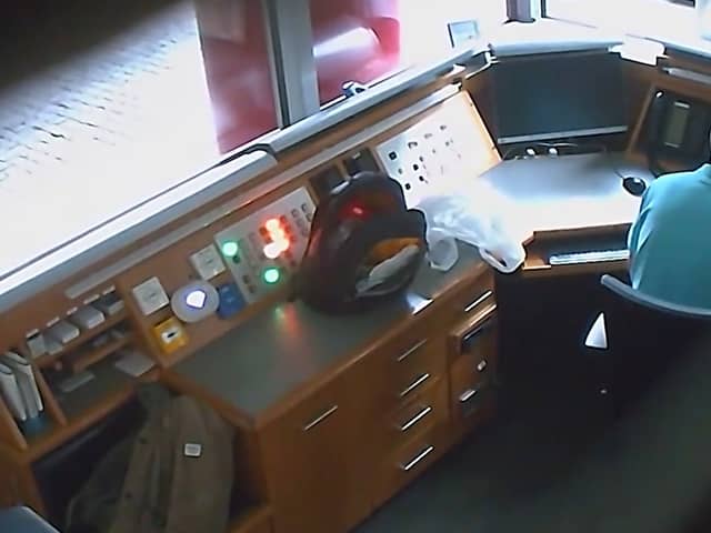 Footage from a covert camera inside the security kiosk at the British Embassy in Berlin shows David Ballantyne Smith recording embassy CCTV footage on his mobile phone.