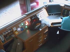 Footage from a covert camera inside the security kiosk at the British Embassy in Berlin shows David Ballantyne Smith recording embassy CCTV footage on his mobile phone.