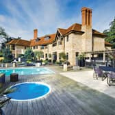 The exterior the property with two swimming pools