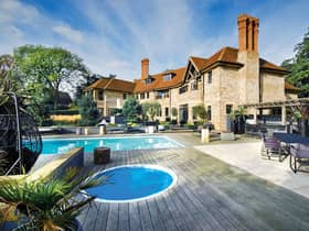 The exterior the property with two swimming pools