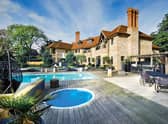 The exterior the property with two swimming pools