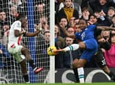 Chelsea’s English midfielder Raheem Sterling (R) has an unsuccessful shot during the English Premier League football match  (Photo by GLYN KIRK/AFP via Getty Images)
