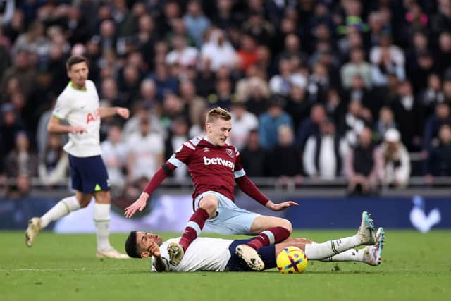 Cristian Romero (bottom) ‘challenges’ Flynn Downes. (Photo by Ryan Pierse/Getty Images)