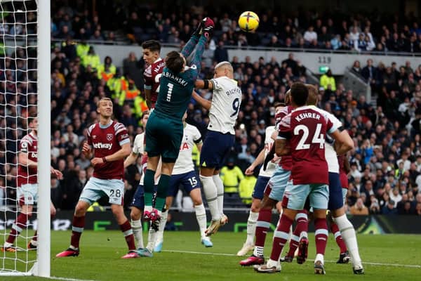 West Ham United’s Polish goalkeeper Lukasz Fabianski punches the ball to make a save during the English Premier League  (Photo by IAN KINGTON/AFP via Getty Images)