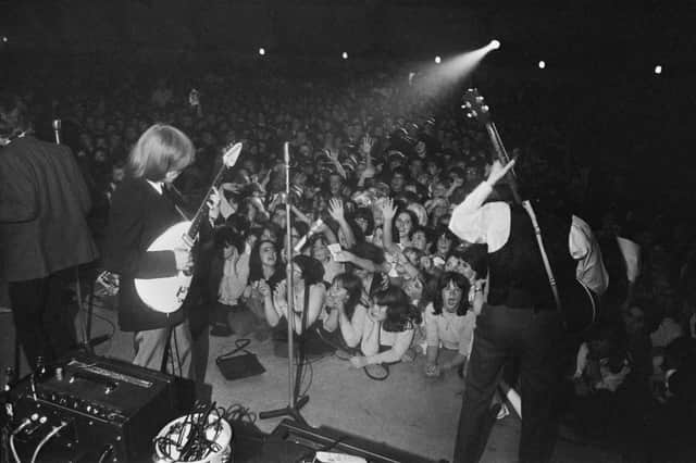 Guitarist Brian Jones and bassist Bill Wyman performing with the Rolling Stones at the Wimbledon Palais in August 1964. (Picture: Davies/Daily Express/Hulton Archive/Getty Images)