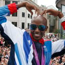 Britain’s double Olympic gold medallist Mo Farah makes his trademark “Mobot” gesture. (Picture: Stefan Wermuth/AFP/GettyImages)