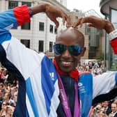 Britain’s double Olympic gold medallist Mo Farah makes his trademark “Mobot” gesture. (Picture: Stefan Wermuth/AFP/GettyImages)