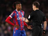 Michael Olise of Crystal Palace speaks with Referee Darren England during the Premier League  (Photo by Catherine Ivill/Getty Images)
