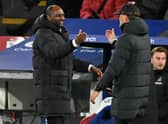 Crystal Palace’s French manager Patrick Vieira (L) shakes hands with Liverpool’s German manager Jurgen Klopp (Photo by GLYN KIRK/AFP via Getty Images)