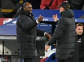 Crystal Palace’s French manager Patrick Vieira (L) shakes hands with Liverpool’s German manager Jurgen Klopp (Photo by GLYN KIRK/AFP via Getty Images)