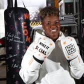 Nicola Adams poses with a punch bag representing a key barrier that prevents women from getting active as part of the launch a ‘This Girl Can’ campaign. (Credit Rachel Adams/PA Wire)