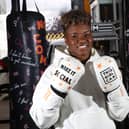 Nicola Adams poses with a punch bag representing a key barrier that prevents women from getting active as part of the launch a ‘This Girl Can’ campaign. (Credit Rachel Adams/PA Wire)