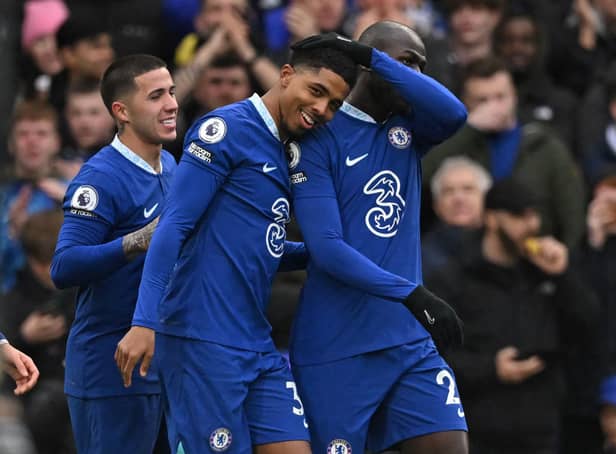 Chelsea’s French defender Wesley Fofana (C) celebrates with teammates after scoring the opening goal  (Photo by JUSTIN TALLIS/AFP via Getty Images)