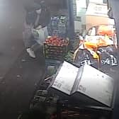 Detectives are appealing for help to identify a man who robbed a shop in Islington while armed with a machete.