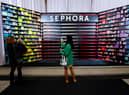 A general view of guests taking photos on their phones during the Sephora UK launch event