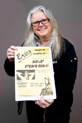 Claire Howell, music memorabilia consultant at Hansons Auctioneers, with the Sex Pistols poster.
