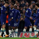 Chelsea’s German midfielder Kai Havertz (L) is mobbed by teammates after scoring the team’s second goal  (Photo by ADRIAN DENNIS/AFP via Getty Images)