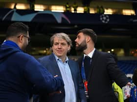 Chelsea’s US owner Todd Boehly (R) reacts after the UEFA Champions League round of 16 second-leg football match (Photo by GLYN KIRK/IKIMAGES/AFP via Getty Images)