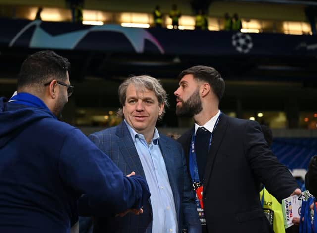 Chelsea’s US owner Todd Boehly (R) reacts after the UEFA Champions League round of 16 second-leg football match (Photo by GLYN KIRK/IKIMAGES/AFP via Getty Images)