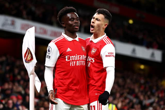Bukayo Saka of Arsenal celebrates with teammate Gabriel Martinelli after scoring the team's first goal during the Premier League match between Arsenal FC and Everton FC at Emirates Stadium on March 01, 2023 in London, England. (Photo by Clive Rose/Getty Images)