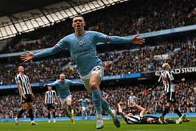 English midfielder Phil Foden celebrates after scoring the opening goal of the English Premier League (Photo by PAUL ELLIS/AFP via Getty Images)
