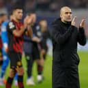  Pep Guardiola applauds the fans after the UEFA Champions League round of 16, first-leg (Photo by ODD ANDERSEN/AFP via Getty Images)