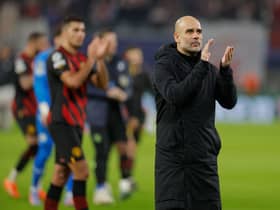  Pep Guardiola applauds the fans after the UEFA Champions League round of 16, first-leg (Photo by ODD ANDERSEN/AFP via Getty Images)