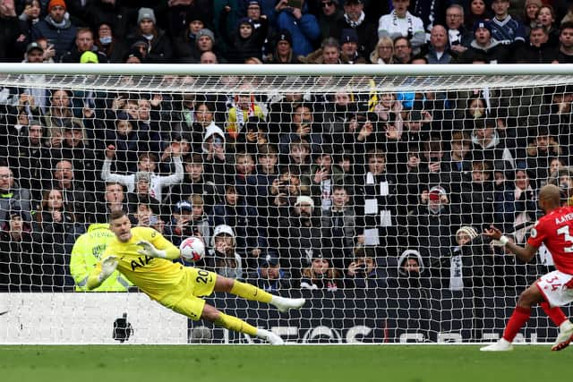 Fraser Forster of Tottenham Hotspur saves a penalty from Andre Ayew (Photo by Catherine Ivill/Getty Images)