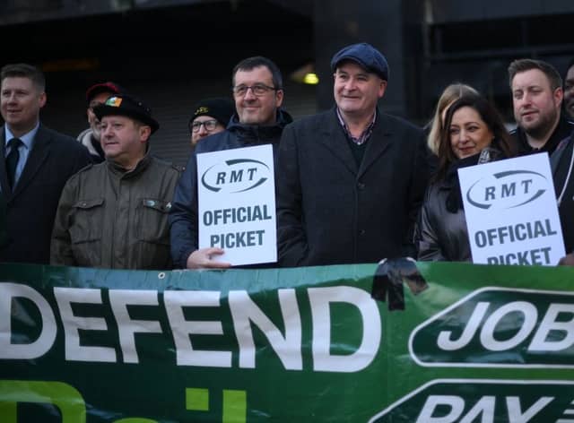 RMT general secretary Mick Lynch (centre) on an RMT picket line during January’s strike (Photo by DANIEL LEAL/AFP via Getty Images)