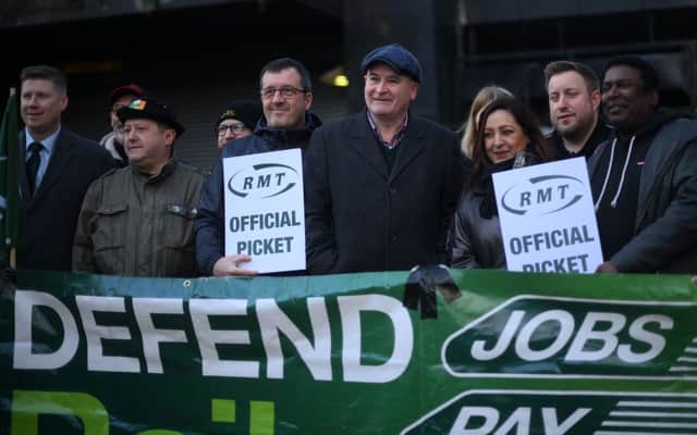 RMT general secretary Mick Lynch (centre) on an RMT picket line during January’s strike (Photo by DANIEL LEAL/AFP via Getty Images)