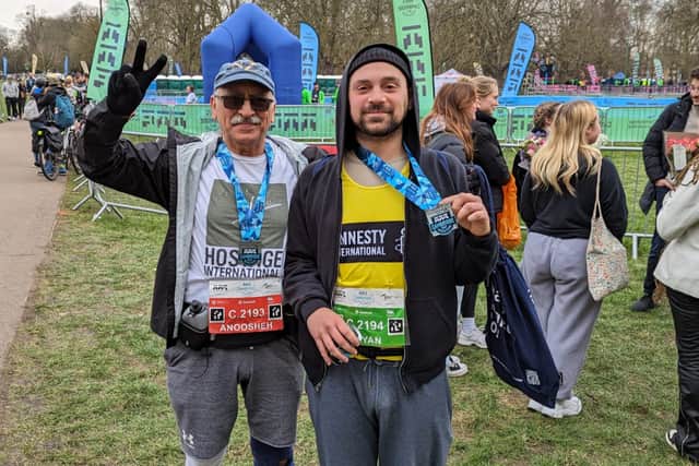 Anoosheh Ashoori (left) and his son Aryan (right) after completing the Cambridge Half Marathon
